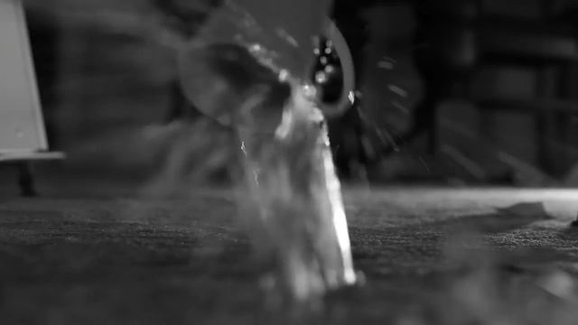 A mug hitting the floor, liquid splashing.